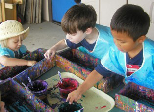children painting marbles