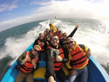 Group of students in boat on gray whale ecology field trip