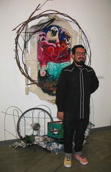 James Swartz standing in front of an art piece