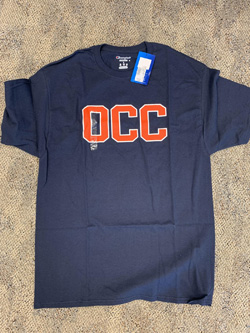 OCC blue shirt with orange text