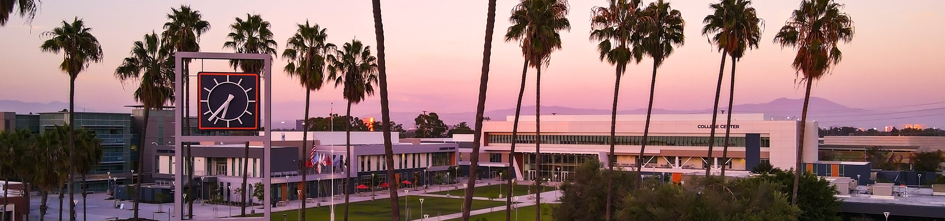 OCC Clock Tower with campus and sunset in background