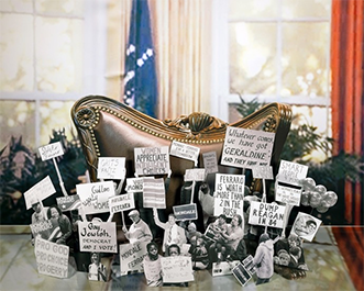photo of oval office desk with black and white photos of past presidents