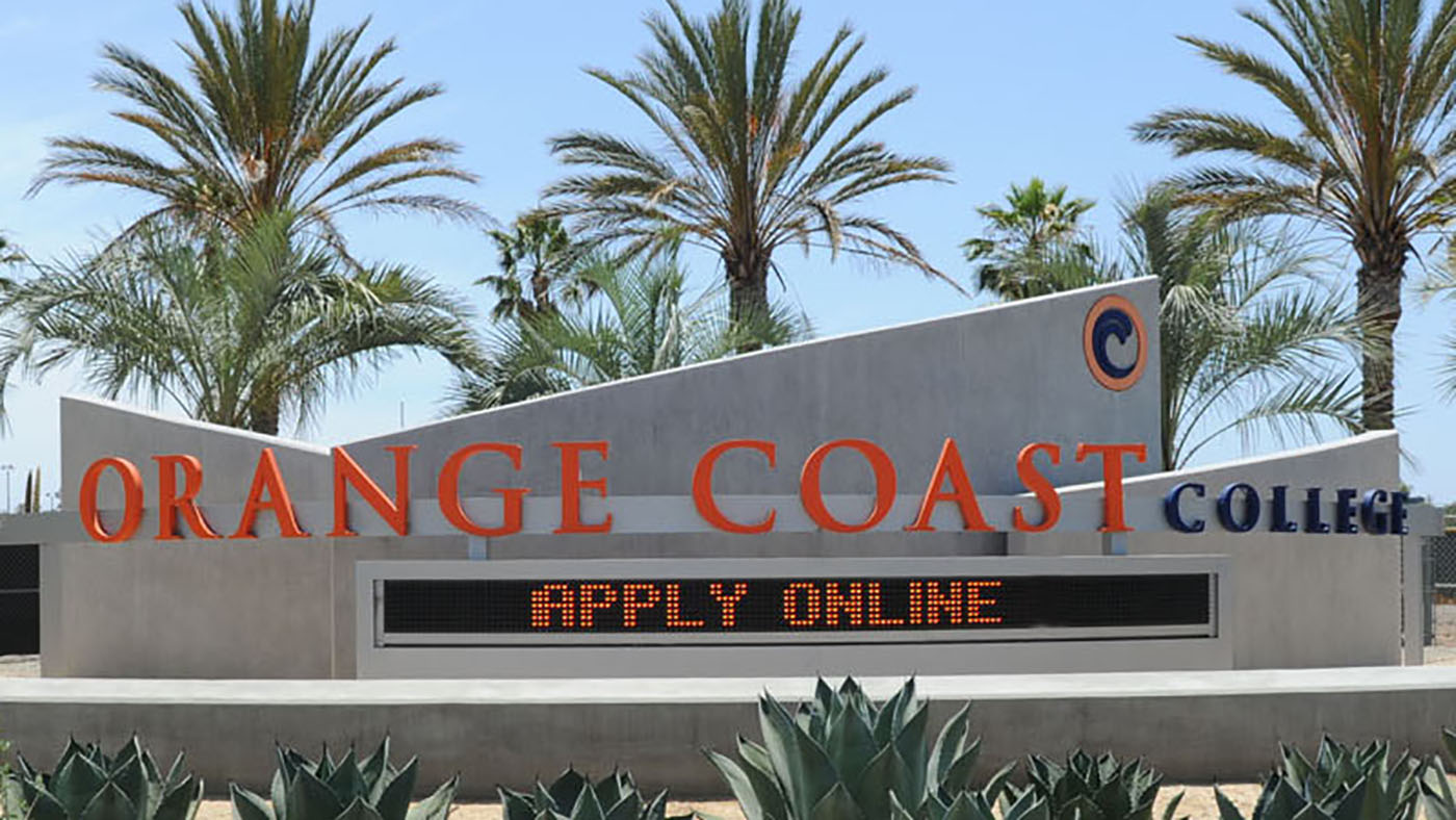 photo of digital banner that says apply now and name of orange coast college with palm trees and blue sky in background
