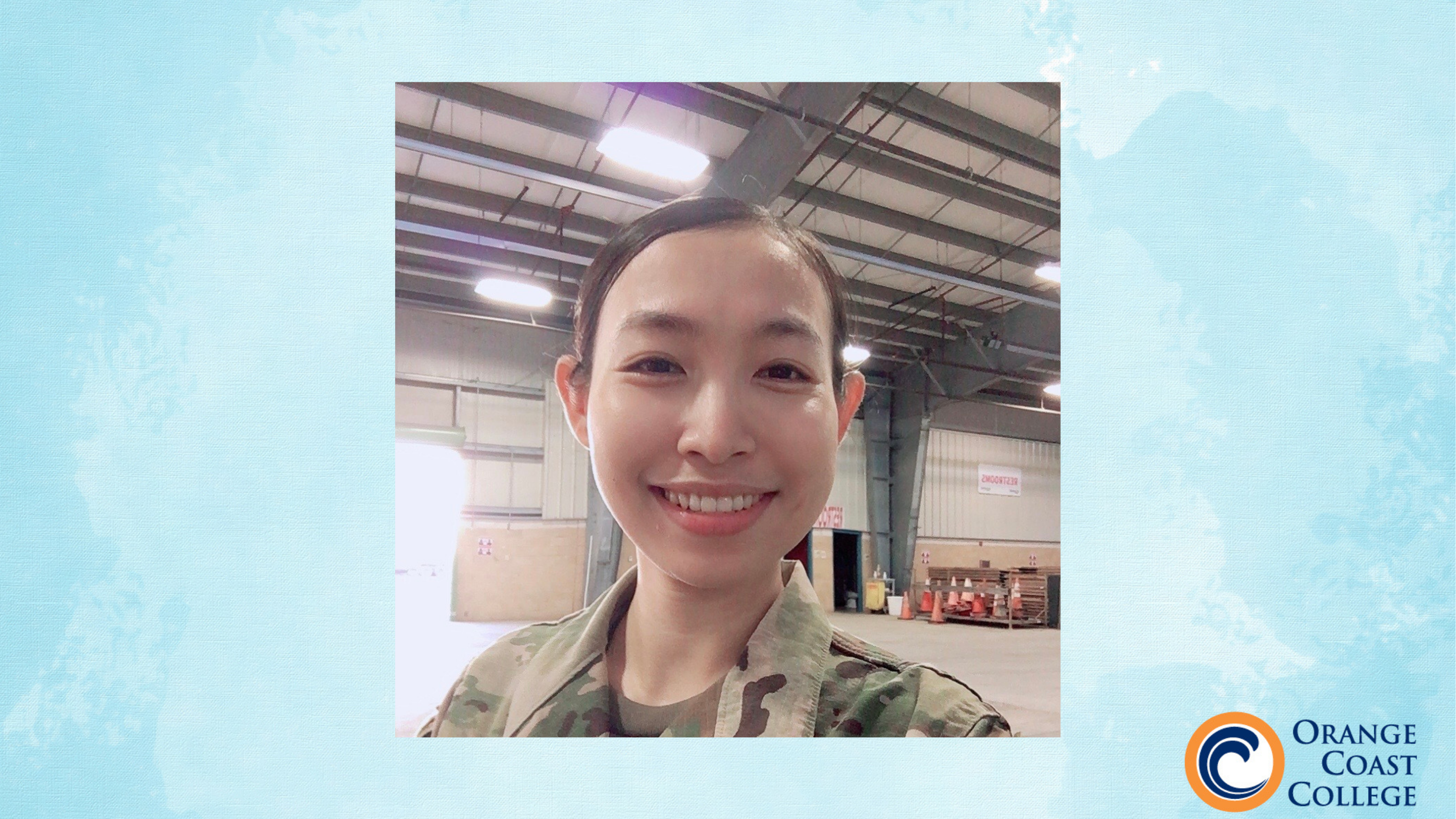 selfie photograph of isabelle phan wearing army uniform. photo is set against light blue watercolor background with orange coast college logo in lower right corner